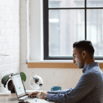 man-sitting-using-laptop-tall500h